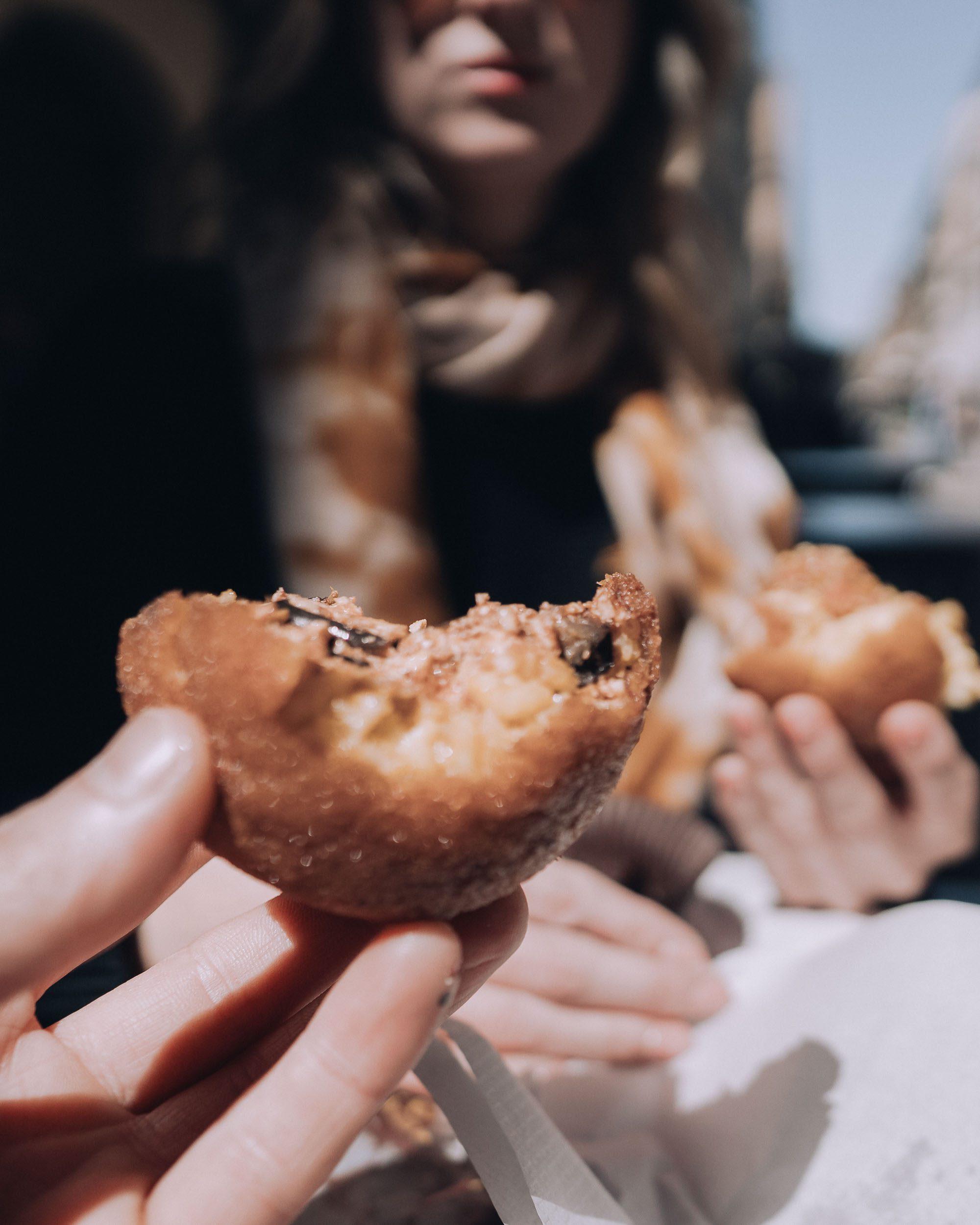 trying an Arancini in Palermo