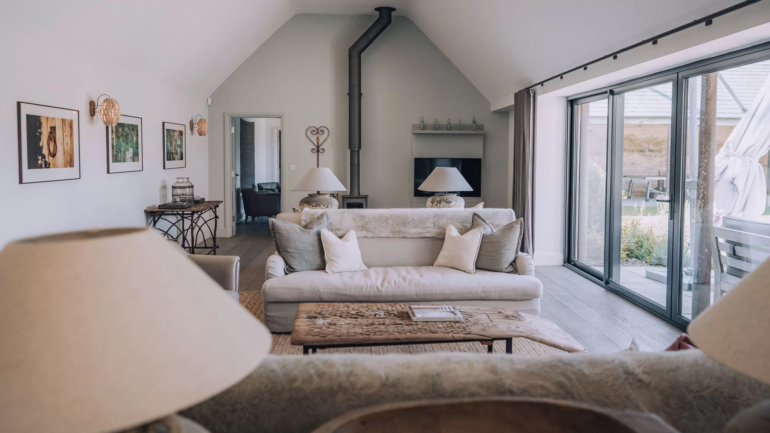 lounge and tv area at Bibury Farm Barns